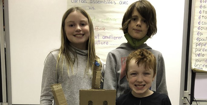 3 students with their robot